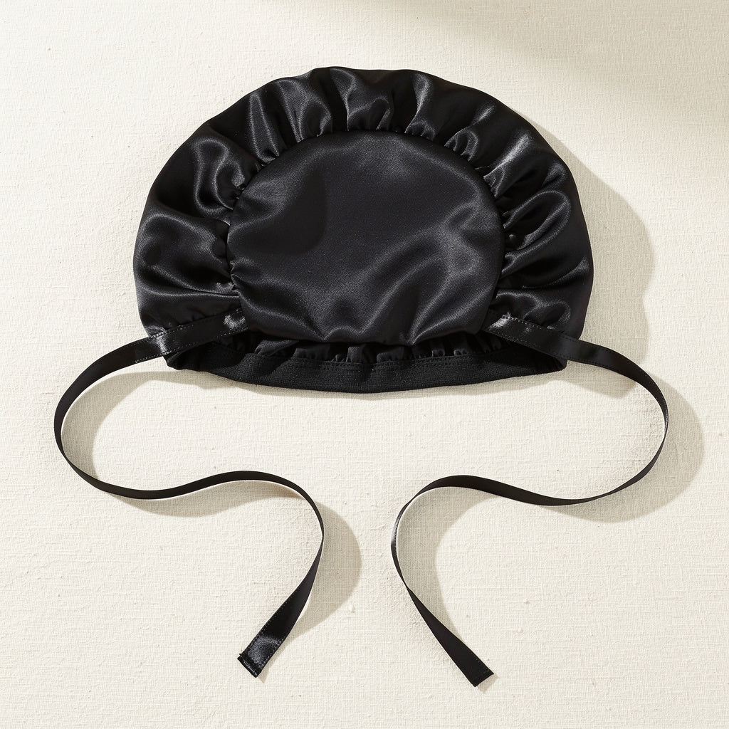 The satin bonnet isn't an extra. It's part of the routine.