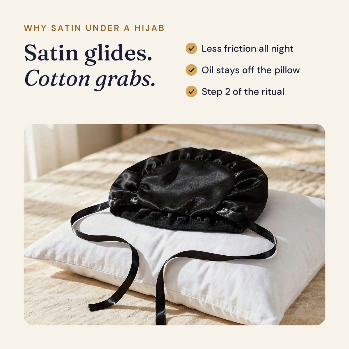 Black satin bonnet on a white pillow: satin glides, cotton grabs