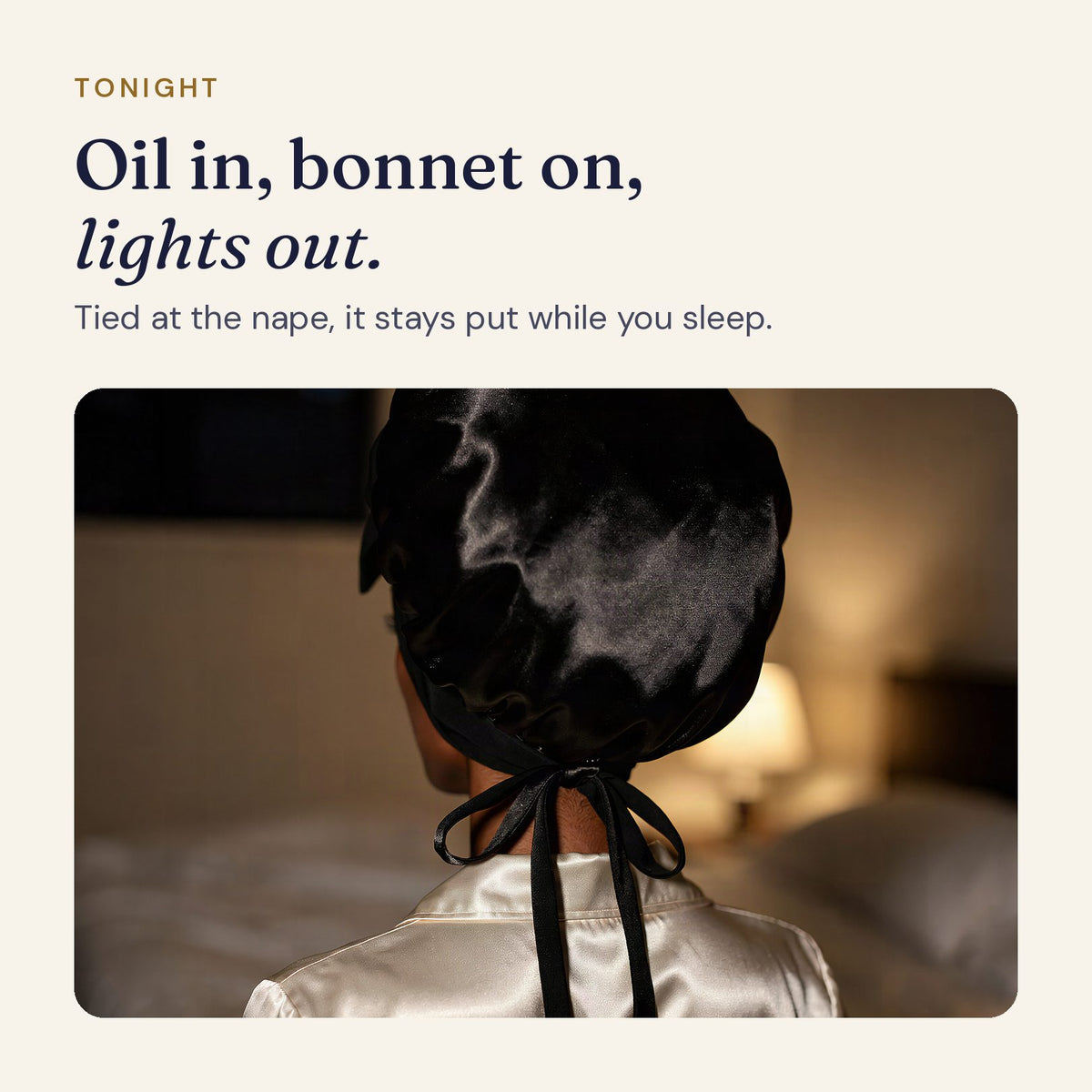 Satin bonnet worn at night with the straps tied in a bow at the nape, seen from behind