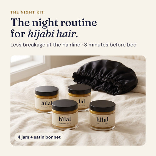 The Hilal Night Kit: four jars of Hilal batana oil and a black satin bonnet on ivory linen